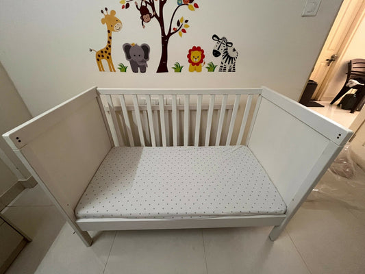 IKEA Sundvik white baby cot with mattress, fitted sheets and cot bumpers, almost new condition, convertible toddler bed design