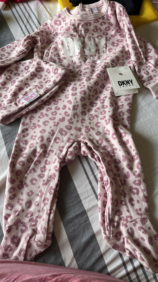 Dress your baby in urban sophistication with the DKNY Baby Romper, crafted for comfort and style in every wear.