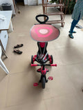 Baby tricycle with a sturdy frame, smooth wheels, ergonomic seat, and parent steering handle—perfect for safe and fun toddler adventures indoors and outdoors.