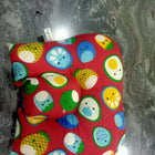 Colorful patterned bag on a marble surface