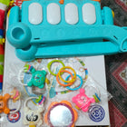 Colorful baby toy set with a bus-shaped rattle and plastic rings 