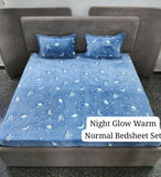 Blue night glow warm normal bedsheet set with star and moon pattern on a bed.