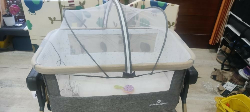 Experience comfort and convenience with the STAR AND DAISY Co-Glide Electric Automatic Cradle Swing, offering gentle gliding motion, adjustable settings, and safety features for a peaceful sleep for your baby.