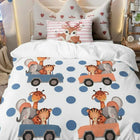 Children's bed comforter with animal designs on a bed 