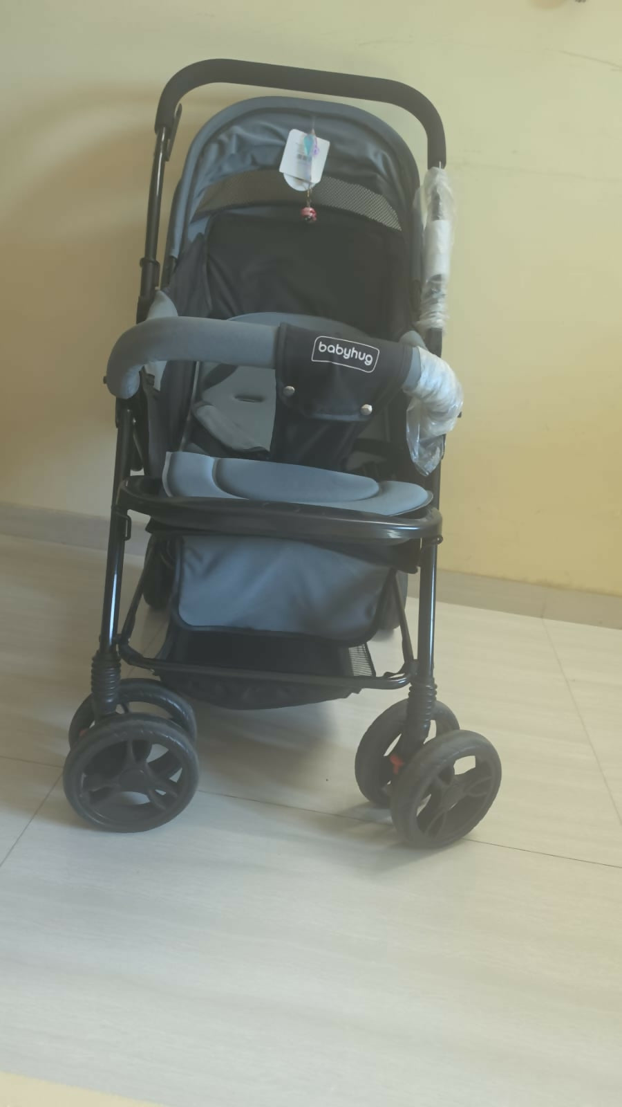 BABYHUG Symphony stroller with reversible handle, reclining seat, safety harness, adjustable canopy, smooth wheels, and comfortable travel support for babies and toddlers.