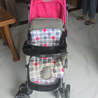 BABYHUG 2 in 1 Rock and Roll stroller cum rocker with reclining seat, sturdy wheels, safety harness, canopy, and dual stroller-to-rocker design for baby comfort and travel.