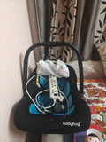 BABYHUG Amber Car Seat Cum Rocker in Almost New condition, featuring comfortable padded seating, safety harness, ergonomic carry handle, protective canopy, and versatile rocking function for convenient infant travel and supervised relaxation.