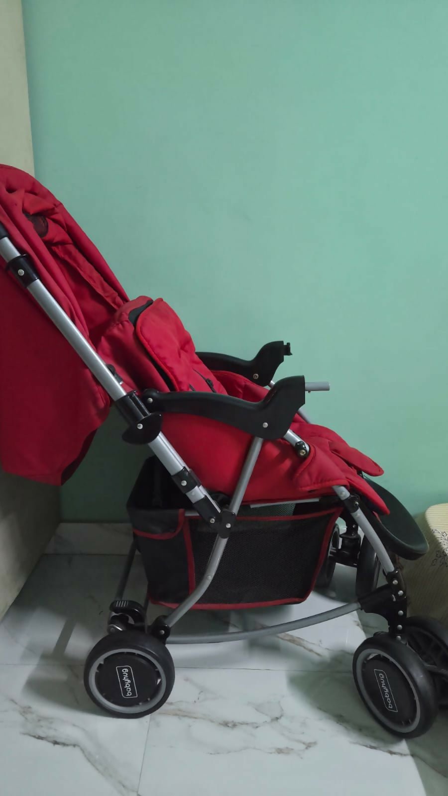BABYHUG 2-in-1 Rock and Roll stroller with reclining seat, foldable design, adjustable canopy, 5-point safety harness, smooth wheels, and storage basket for comfortable everyday travel.