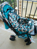BABYHUG Cocoon Blue stroller with reclining seat, smooth wheels, safety harness, adjustable canopy, and comfortable travel design for babies and toddlers.
