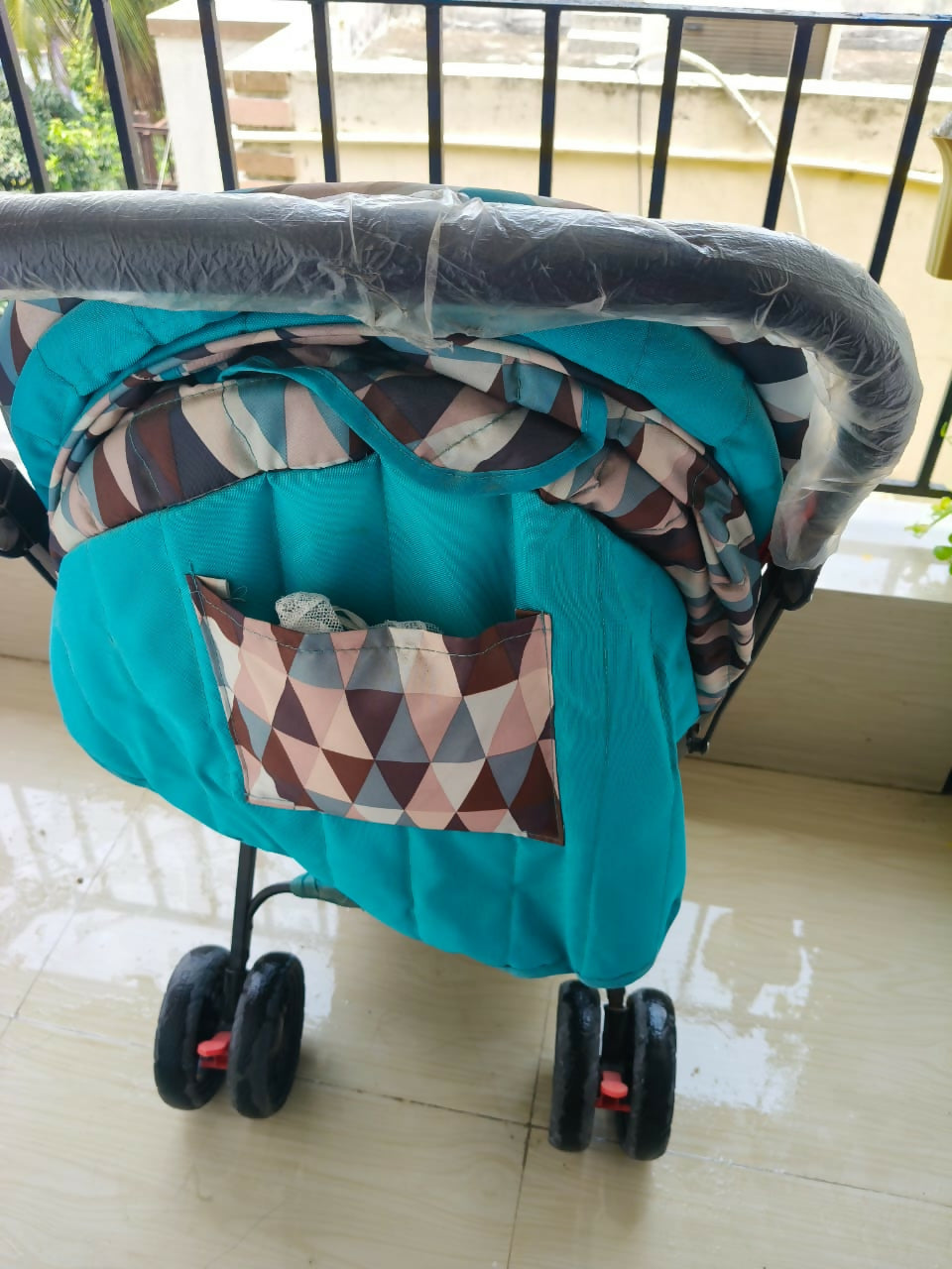 BABYHUG Cocoon Blue stroller with reclining seat, smooth wheels, safety harness, adjustable canopy, and comfortable travel design for babies and toddlers.