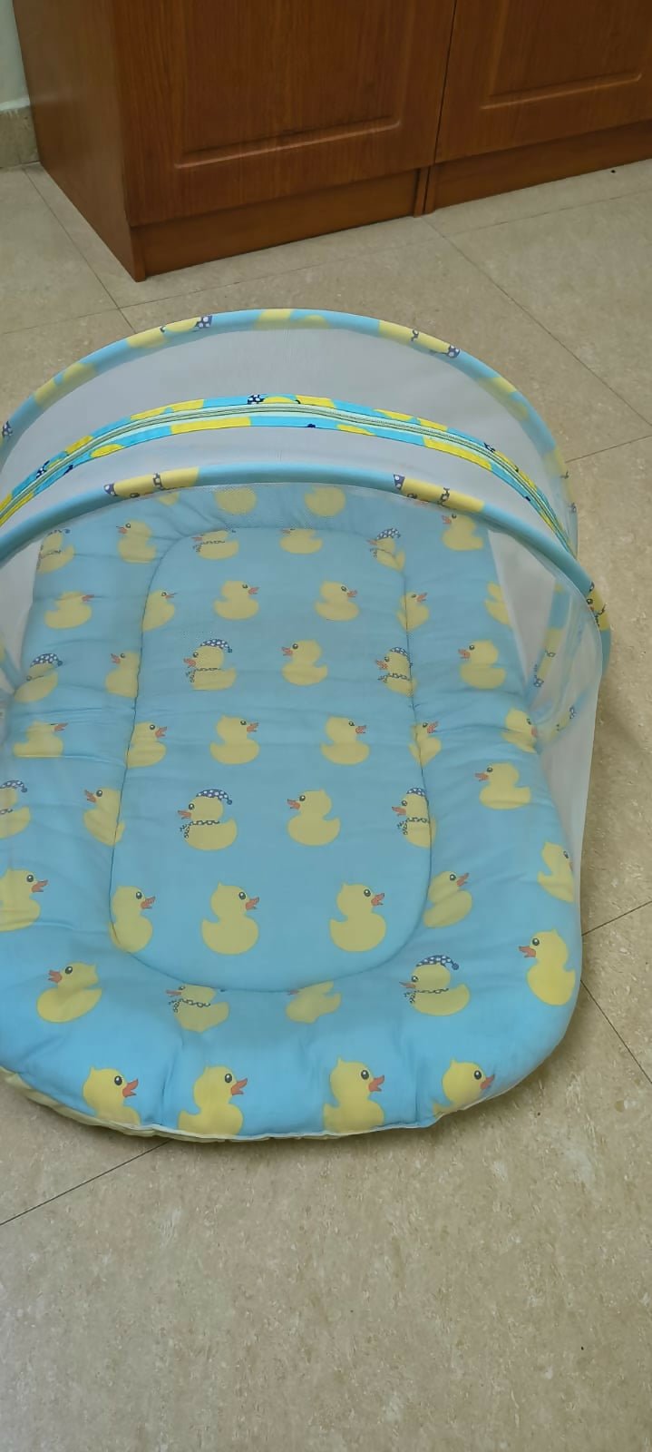BABYHUG cotton bedding set with mosquito net featuring a soft mattress, pillow, breathable cotton fabric, and protective mosquito net for a comfortable and secure sleeping environment for babies.