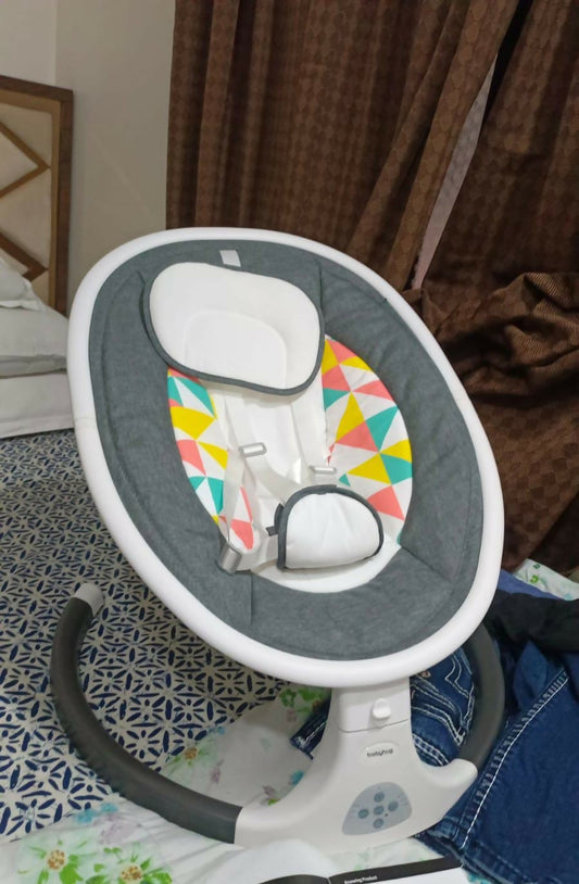 BABYHUG Electric Rocker with comfortable padded seating, gentle automatic rocking motion, safety harness, supportive backrest, and convenient design for supervised soothing, relaxation, and playtime.