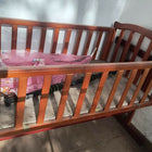 BABYHUG Lonia wooden baby cradle crib with sturdy wooden construction, cozy sleeping space, gentle rocking design, and comfortable support for newborns and babies.