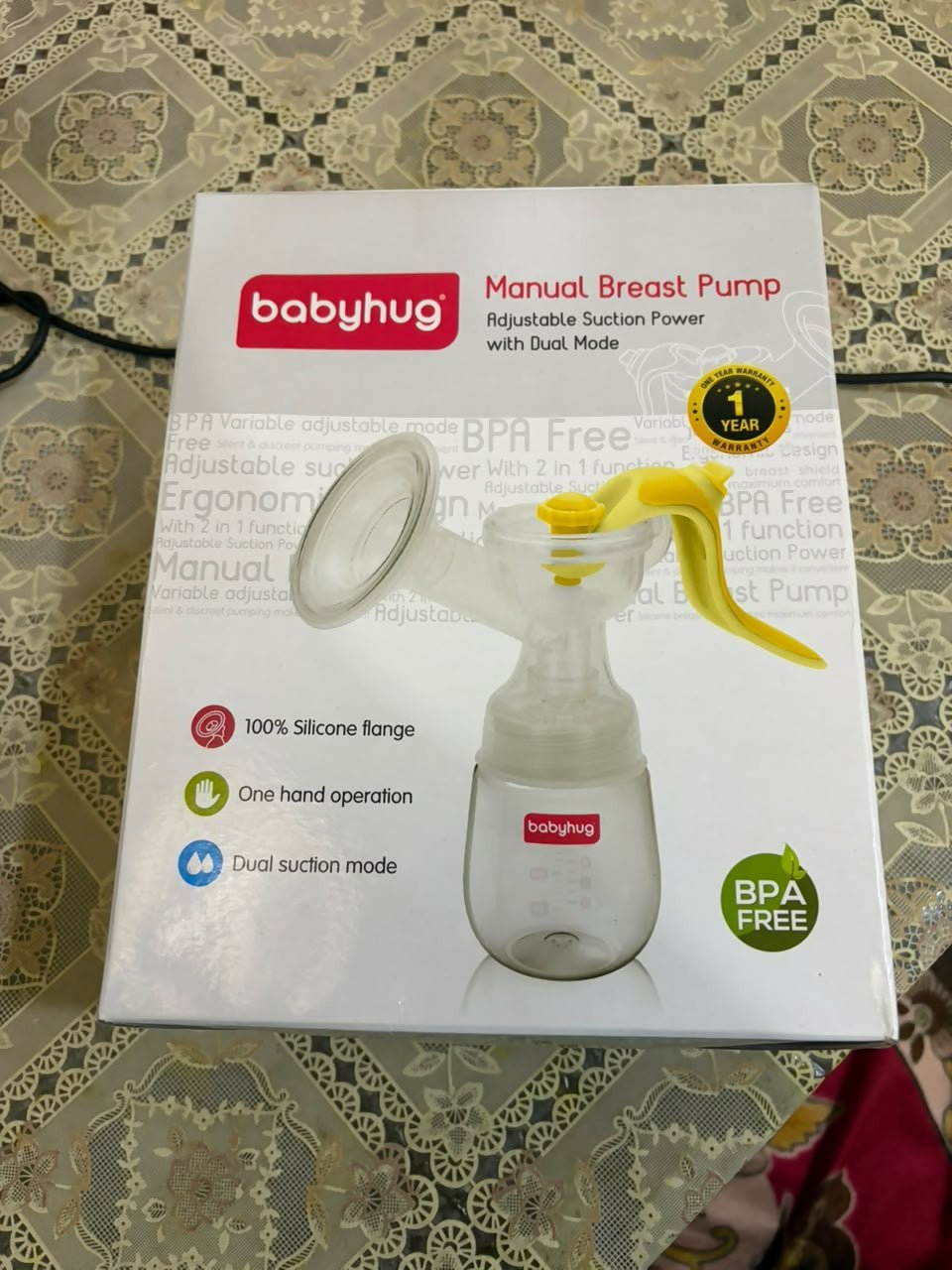 BABYHUG Manual Breast Pump with ergonomic hand pump, soft silicone massage cushion, BPA-free components, lightweight portable design, and comfortable manual milk expression for breastfeeding mothers.