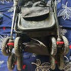 BABYHUG Cocoon stroller with mosquito net, reclining seat, safety harness, protective canopy, smooth wheels, and comfortable travel design for babies.