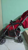BABYHUG 2-in-1 Rock and Roll stroller with reclining seat, foldable design, adjustable canopy, 5-point safety harness, smooth wheels, and storage basket for comfortable everyday travel.