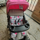 BABYHUG stroller/pram with a lightweight foldable design, reclining seat, adjustable canopy, 5-point safety harness, smooth-rolling wheels, and a spacious storage basket for safe and comfortable travel with babies and toddlers.