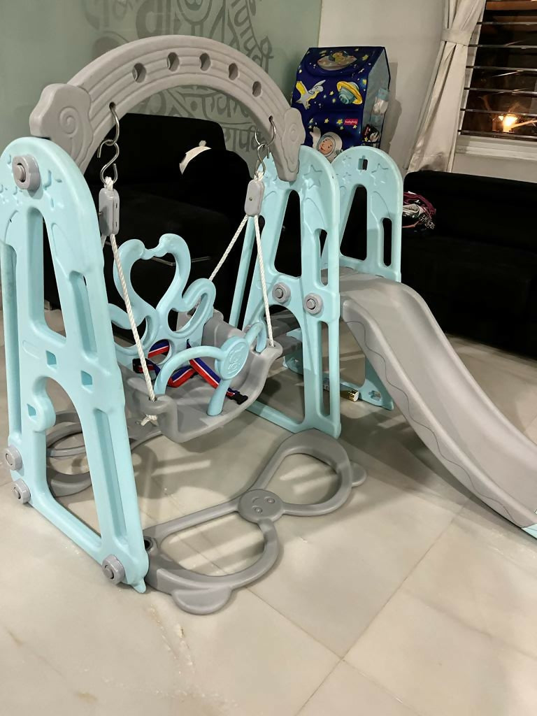 BAYBEE Twinkle 4-in-1 Swing & Slider Foldable Baby Garden Slide with swing, slide, basketball hoop, foldable design, sturdy construction, and smooth edges for safe indoor and outdoor play.