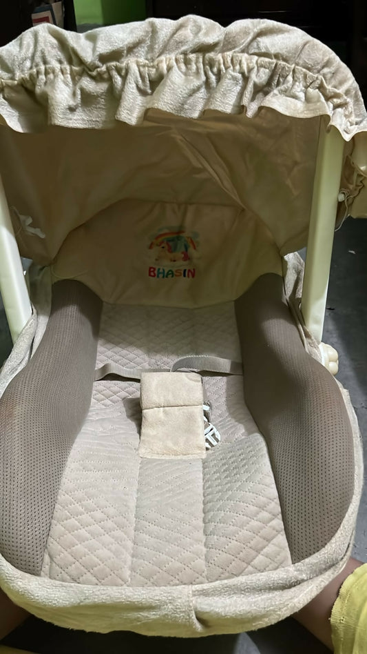 BHASIN Baby Carry Cot in Almost New condition featuring comfortable padded seating, supportive handles, and a practical portable design for conveniently carrying and resting your baby during everyday use and outings.