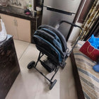 Baby stroller/pram with a foldable design, reclining seat, adjustable canopy, 5-point safety harness, smooth wheels, and spacious storage basket for safe and comfortable travel with babies and toddlers.