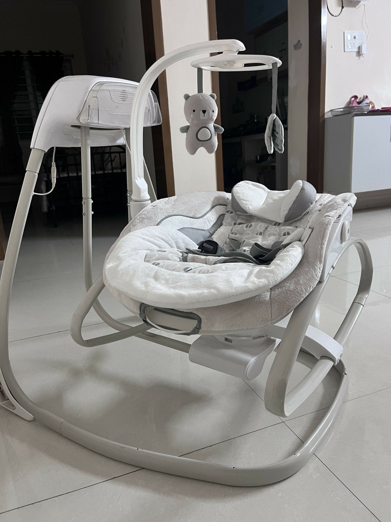 INGENUITY gliding swing and rocker with gentle gliding motion, cushioned seat, safety harness, and soothing design for relaxing, comforting, and entertaining babies.