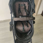 Evenflo travel system with baby stroller and infant car seat, featuring a foldable design, reclining seat, adjustable canopy, 5-point safety harness, and spacious storage basket for convenient travel.