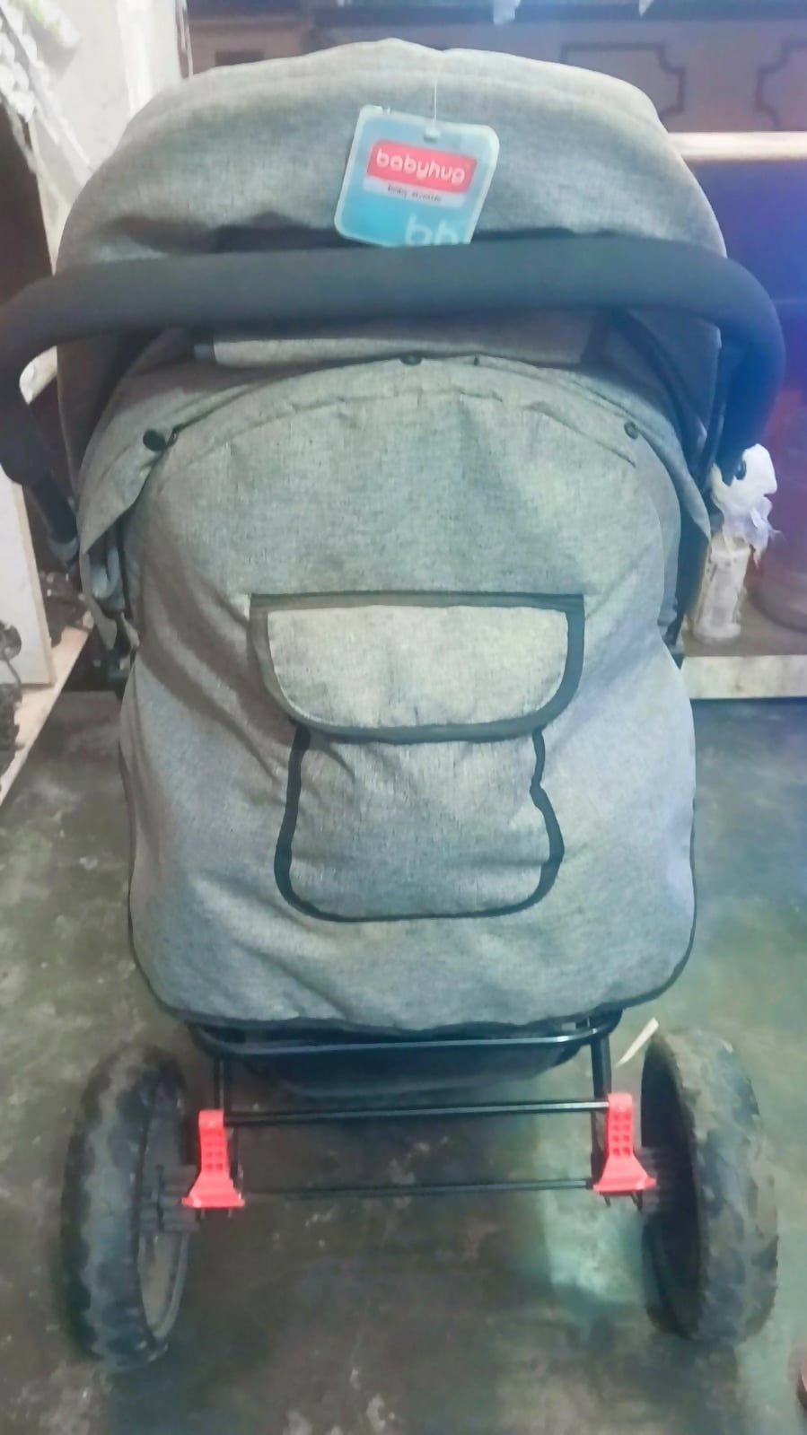 Babyhug Melody stroller with a reversible handle, adjustable canopy, reclining seat, 5-point safety harness, smooth wheels, and a lightweight foldable design for comfortable everyday travel.