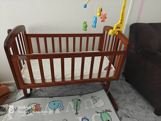 BABYHUG Joy Baby Cradle with Mattress for comfortable rest and gentle rocking.