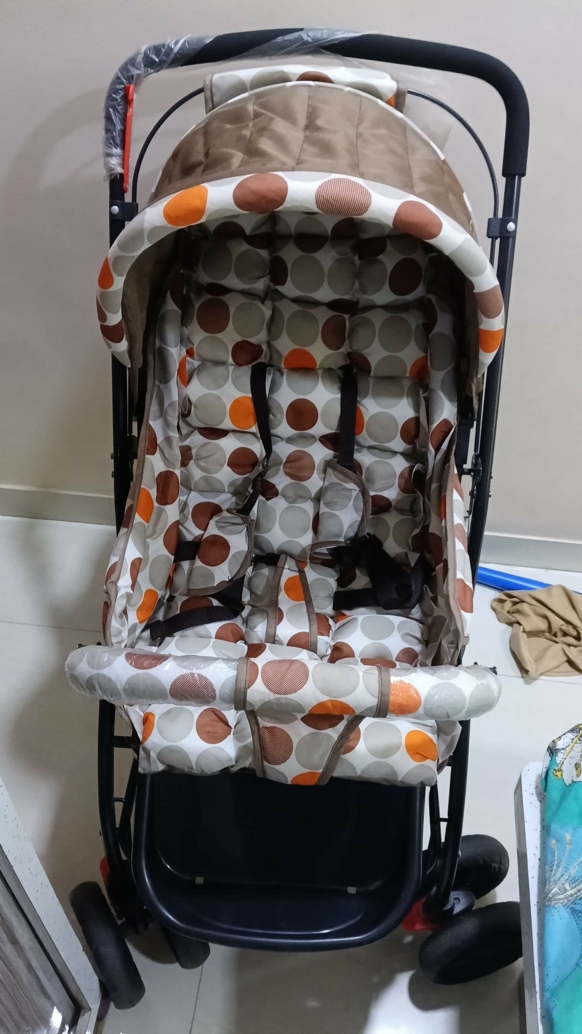 BABYHUG stroller with a lightweight foldable design, reclining seat, adjustable canopy, 5-point safety harness, smooth wheels, and spacious storage basket for comfortable travel with babies and toddlers.