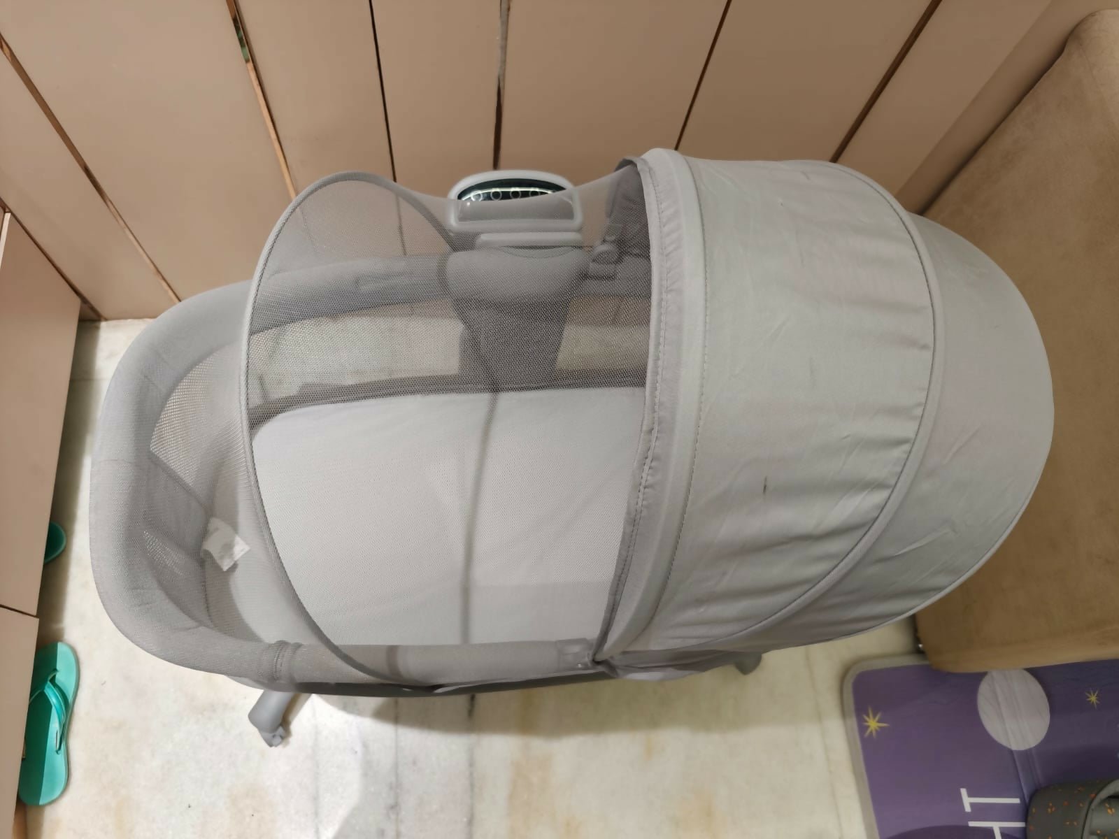 MASTELA Dream Starlight bedside bassinet and rocker with sunshade, mosquito net, removable cradle basket, touch control panel, and a sturdy frame for comfortable sleeping and soothing newborns.
