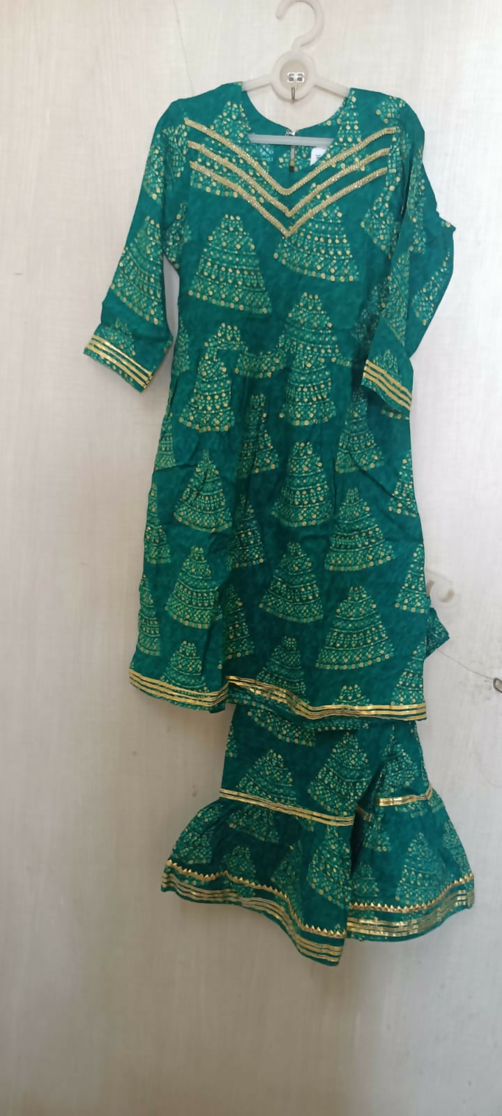 Make a style statement with our Beautiful Green Color Peplum Top and Garara Set, offering elegance and sophistication for festive occasions and parties.