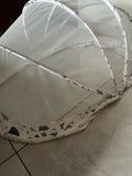 Large mosquito net made from fine breathable mesh with full-coverage protection, lightweight construction, and easy installation for cribs, beds, cots, or sleeping areas.