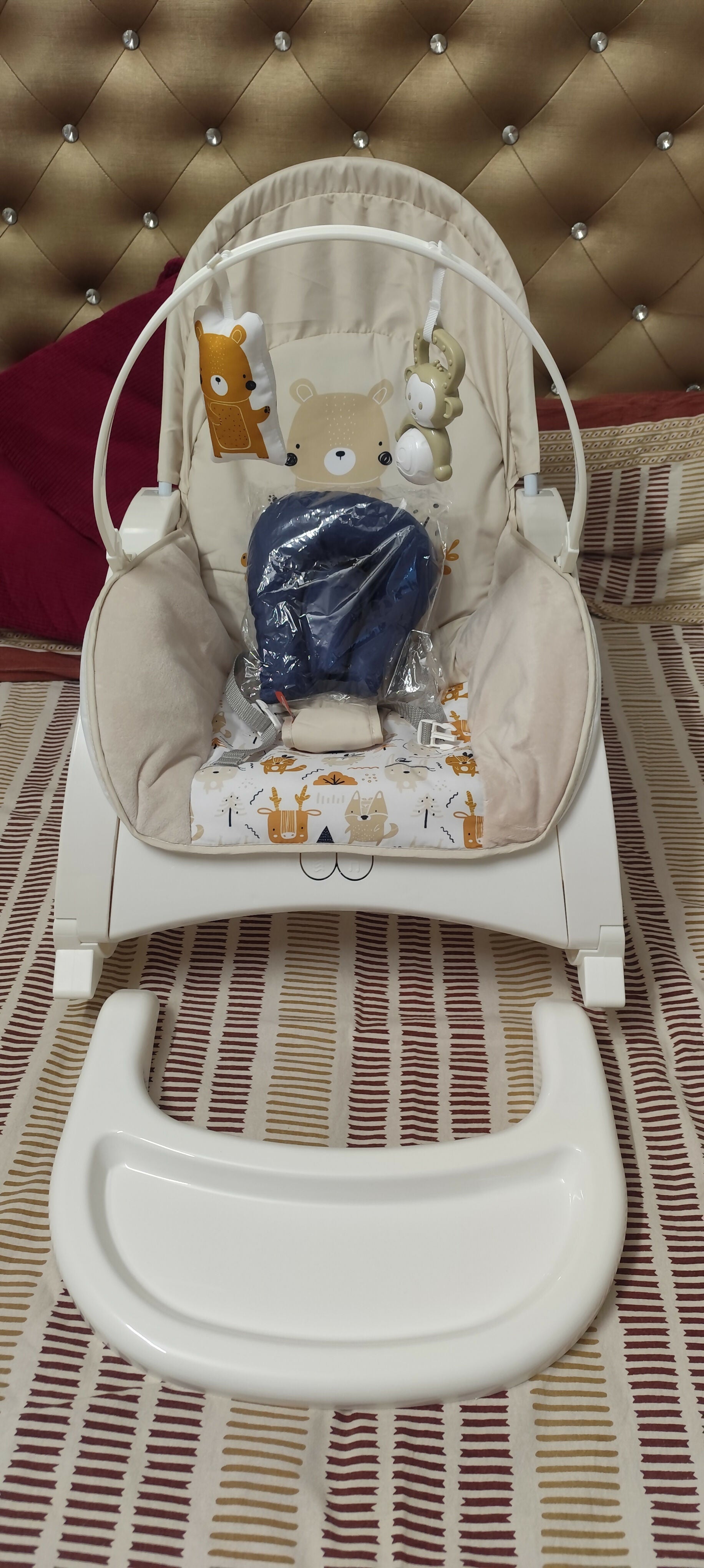 INFANTSO baby rocker and bouncer in beige for 0–2 years with cushioned seat, gentle rocking motion, secure harness, and comfortable design for baby relaxation and play.