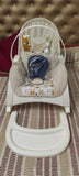 INFANTSO baby rocker and bouncer in beige for 0–2 years with cushioned seat, gentle rocking motion, secure harness, and comfortable design for baby relaxation and play.