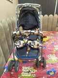 Baby stroller with patterned canopy  with cartoon designs