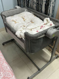 Chicco Next2Me Magic Eco co-sleeping crib with adjustable height, breathable mesh sides, drop-down side panel, lockable wheels, and a comfortable mattress for safe bedside sleeping.