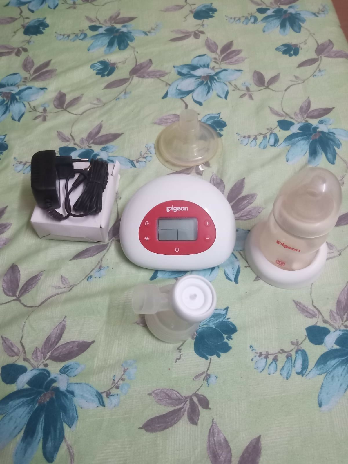 Pigeon electric breast pump with adjustable suction levels, soft silicone breast cushion, quiet operation, and efficient milk expression for comfortable breastfeeding support.