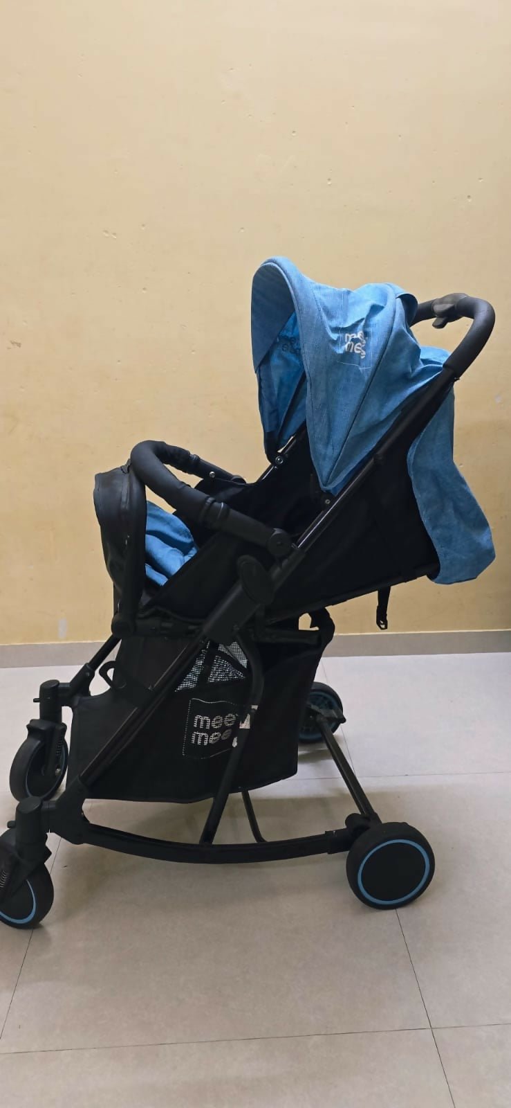 MEE MEE 2-in-1 stroller/pram with rocking function, foldable design, reclining seat, adjustable canopy, 5-point safety harness, smooth wheels, and storage basket for comfortable travel and soothing babies.