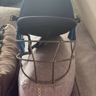 Cricket safety helmet and cricket cap designed for young players with protective construction, comfortable fit, adjustable support, and sporty styling for practice sessions and matches.