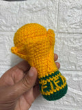 Handcrafted crochet FIFA World Cup-inspired keychain made from soft yarn, featuring a miniature football-themed design with durable key ring attachment, perfect for football fans, gifting, and everyday use.