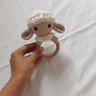 Handmade crochet rattle for babies with soft yarn construction, easy-to-hold design, gentle rattling sound, and baby-friendly craftsmanship for sensory play and development.