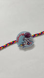 Personalized kids Rakhi featuring a custom name design, soft child-friendly materials, colorful embellishments, and a comfortable thread for celebrating Raksha Bandhan.