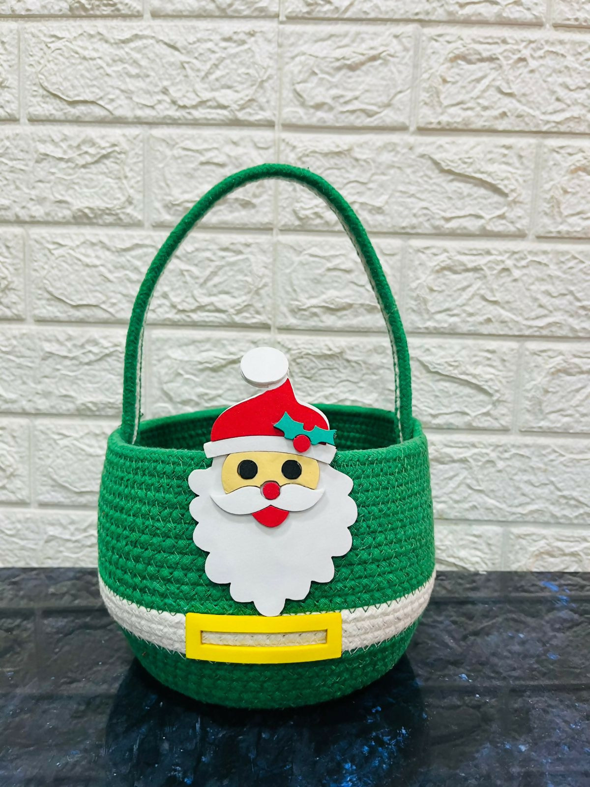 Green basket with Santa Claus face design 