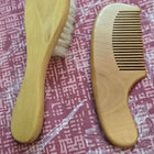 Imported wooden comb and brush set with rubber bands—gentle, eco-friendly, and perfect for baby hair care and styling.