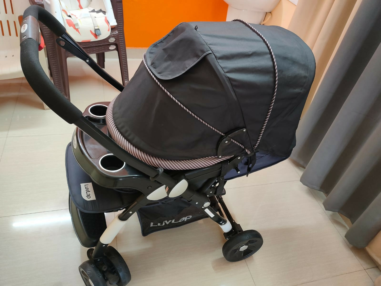 Buy LuvLap Baby Stroller – Safe, foldable pram with reclining seat, safety harness, and storage basket for newborns and toddlers.
