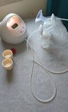 SPECTRA S2 Plus hospital-grade double electric breast pump with dual pumping system, adjustable suction settings, milk collection bottles, and comfortable breastfeeding support for nursing mothers.