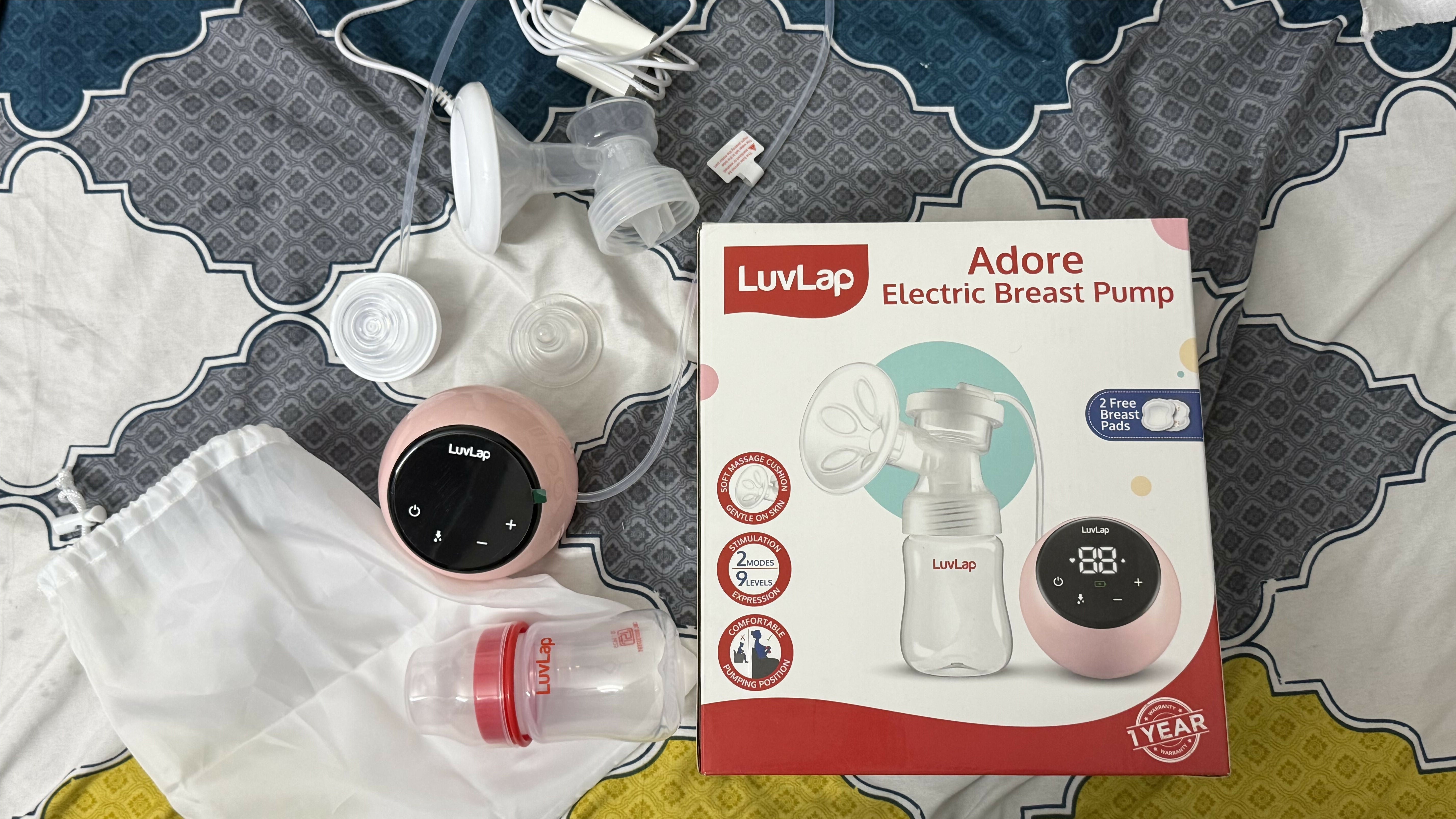Luvlap breast pump set with packaging on a patterned surface