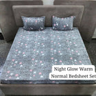 Gray star-patterned bedsheet set on a bed with pillows