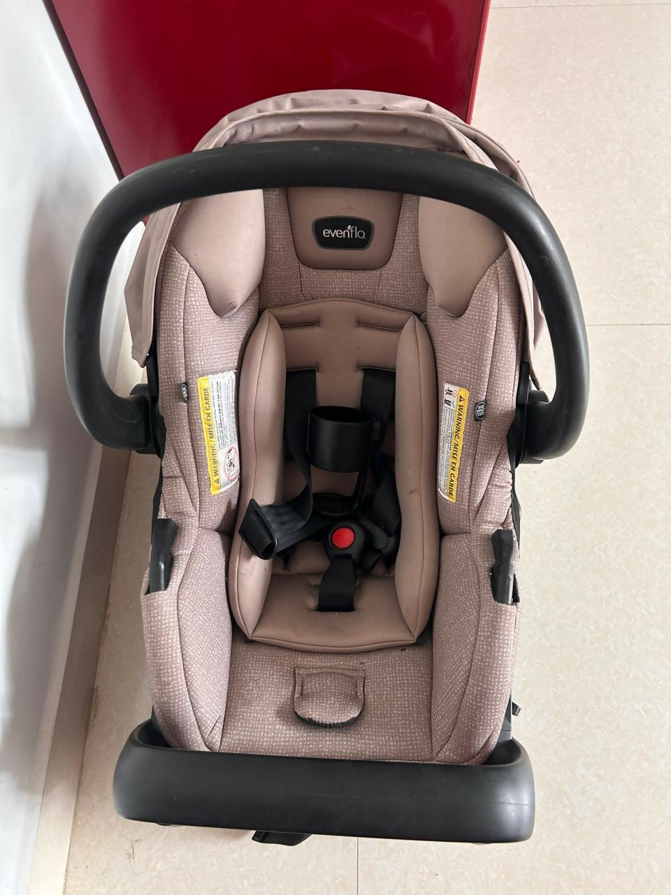 Evenflo LiteMax infant car seat with cushioned newborn support, secure safety harness, lightweight portable design, and comfortable seating for safe baby travel.