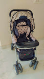 Black stroller with patterned canopy 